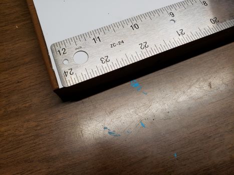 ruler overhanging board edge